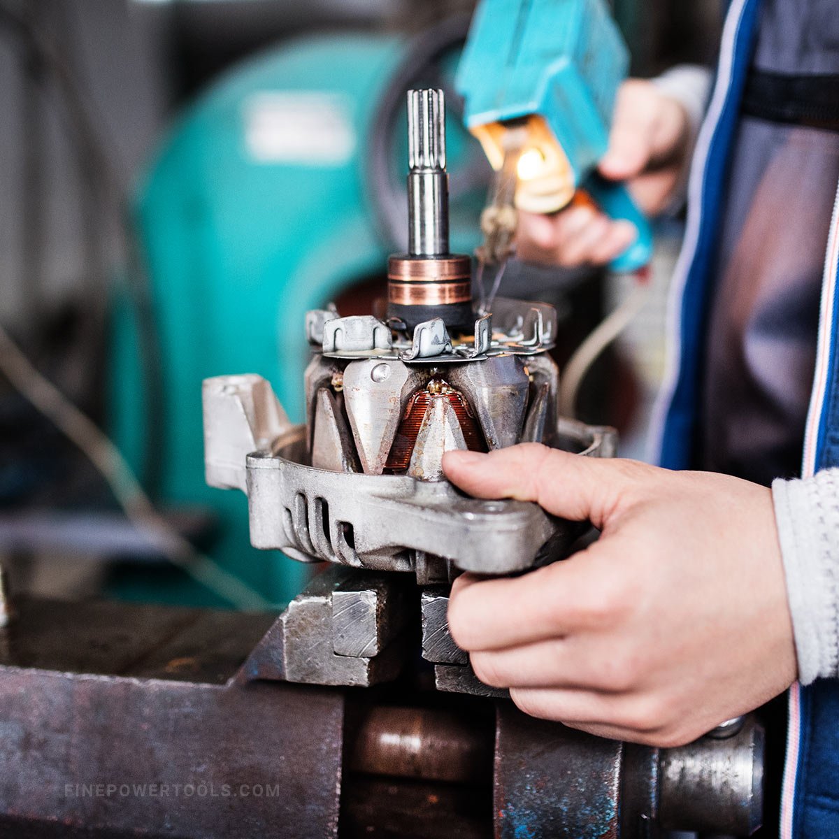 Mechanic repairing car parts using soldering iron