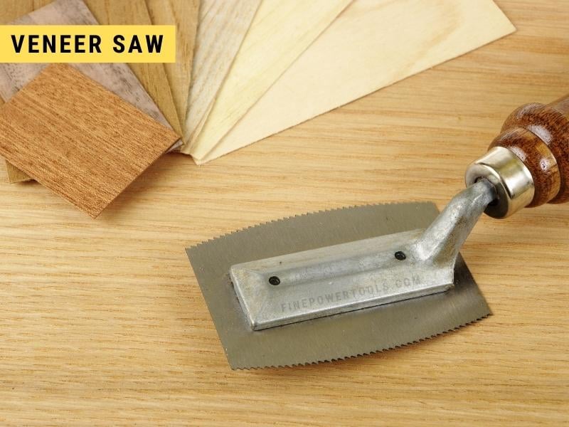 Stack of veneers and veneer saw